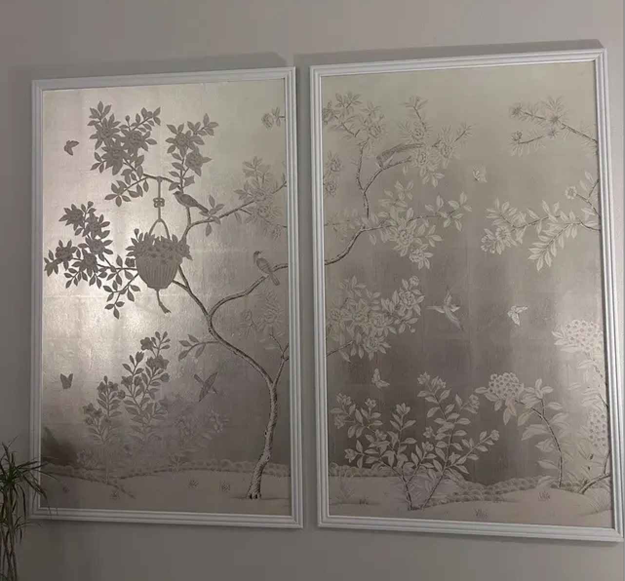 Hand-painted chinoiserie wall art panel displayed in modern dining room with silver metallic leaf wallpaper background