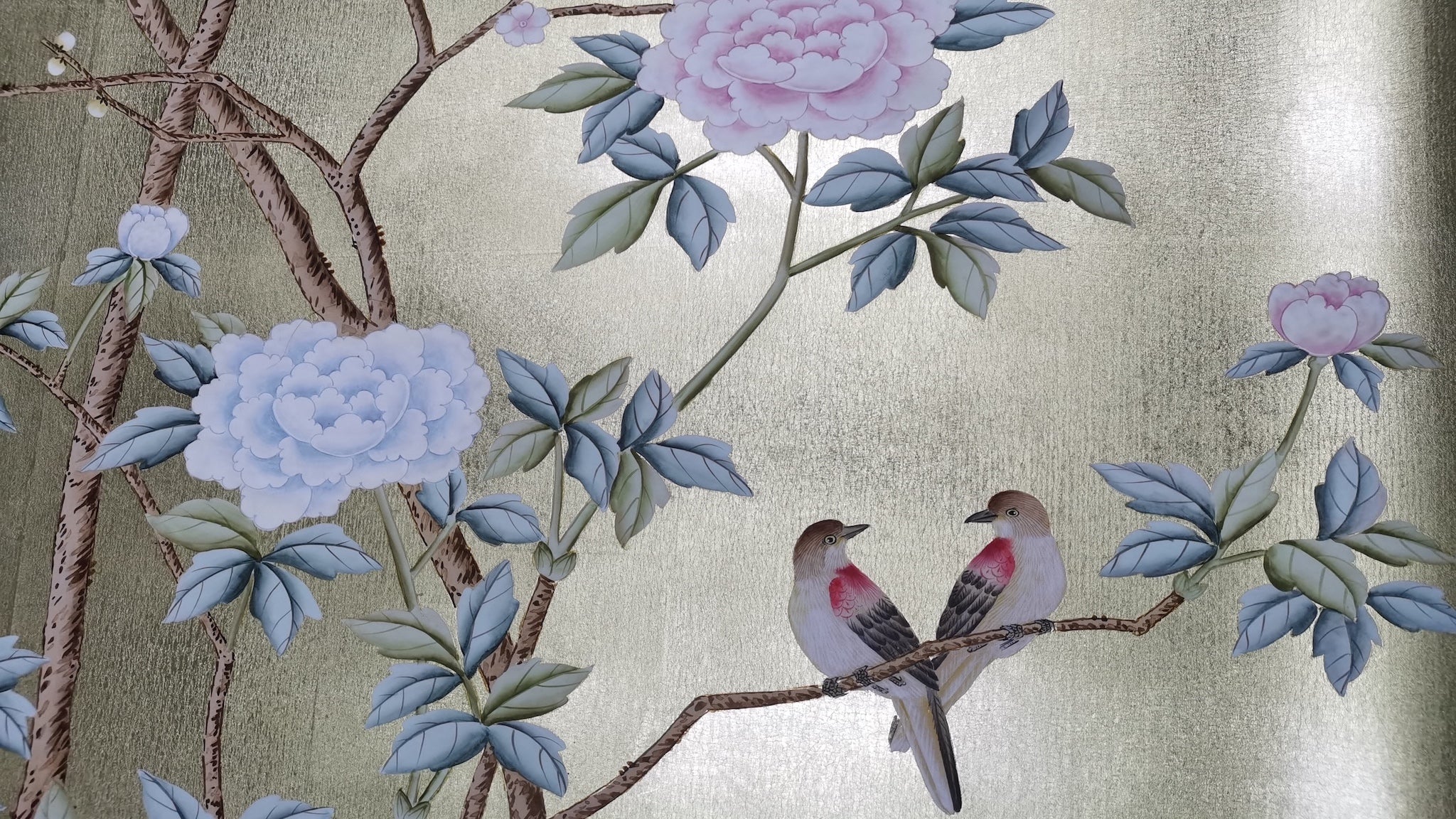 Close-up of peony and songbirds brushwork on hand-painted gold leaf wallpaper panel