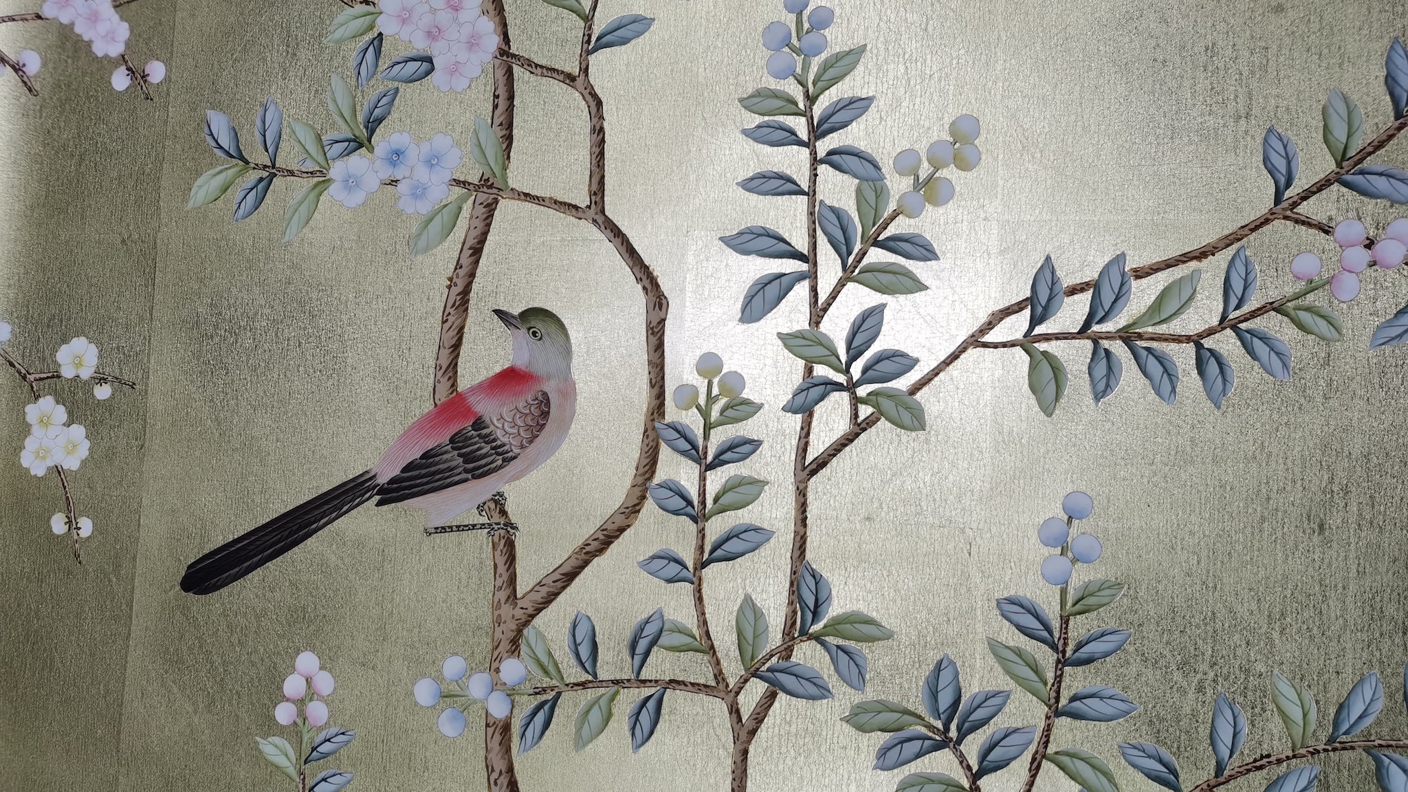 Close-up of peony and songbirds brushwork on hand-painted gold leaf wallpaper panel