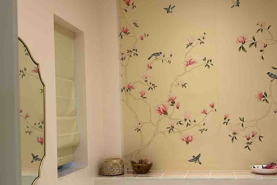 Elegant powder room with chinoiserie hand-painted magnolia mural in pink and ivory tones