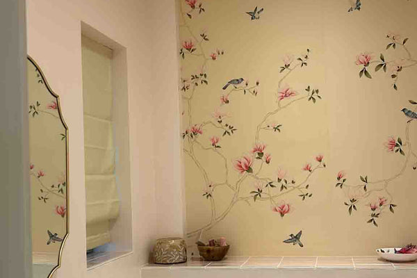 Elegant powder room with chinoiserie hand-painted magnolia mural in pink and ivory tones