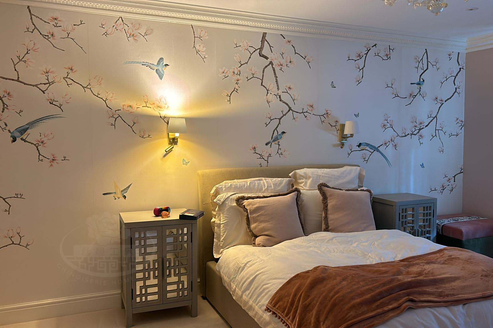 Hand-painted magnolia and bird chinoiserie wallpaper in Japandi-style bedroom on slub silk